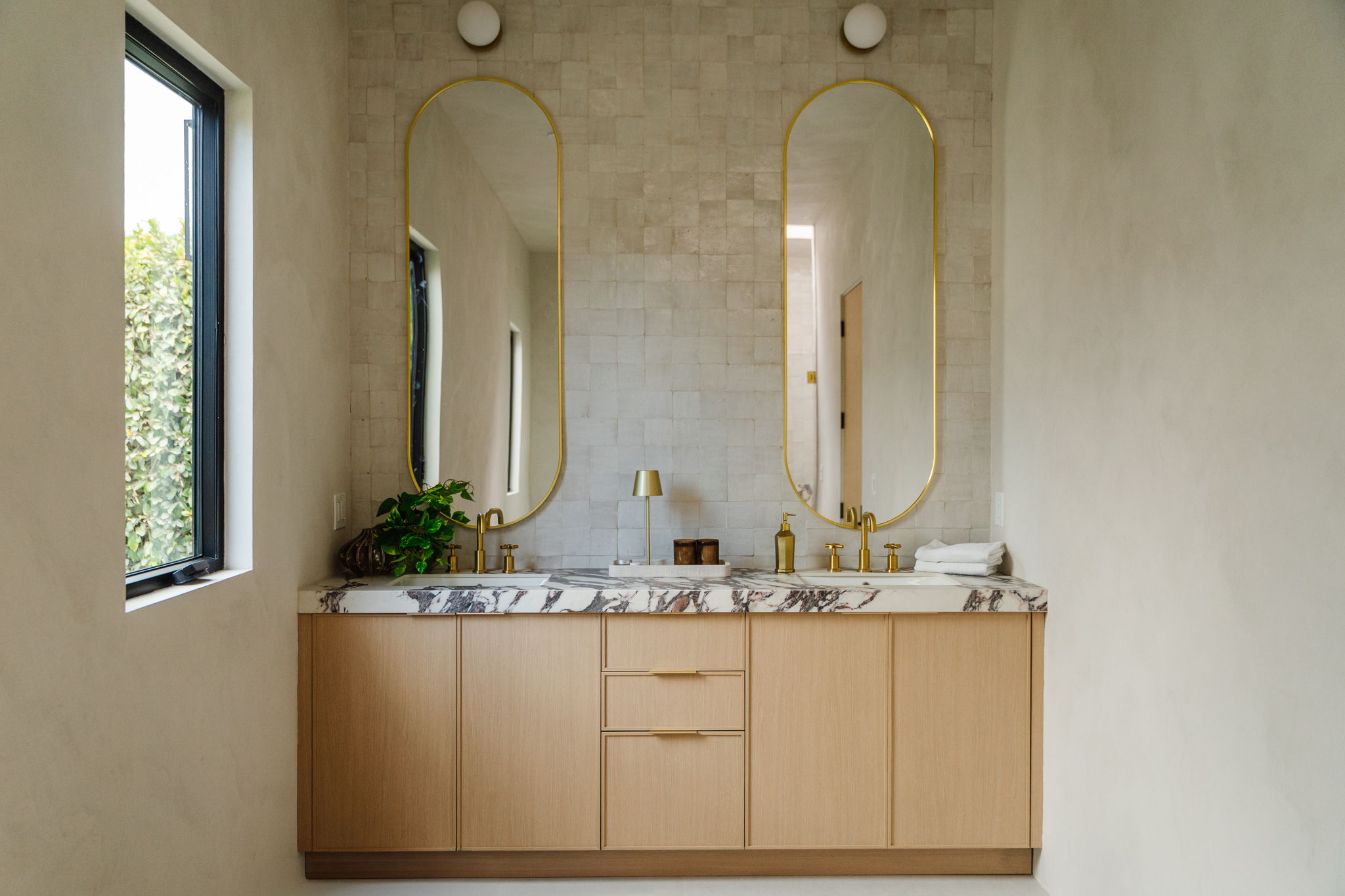 Echo Park bathroom with a freestanding tub and warm natural finishes
