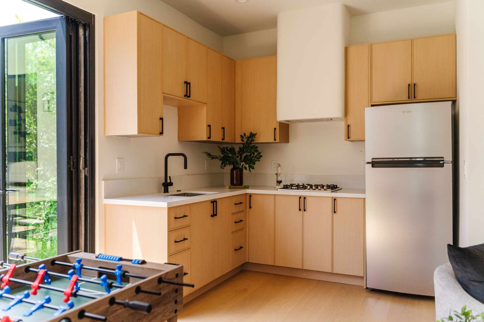 Bright Pasadena kitchen island with warm wood details