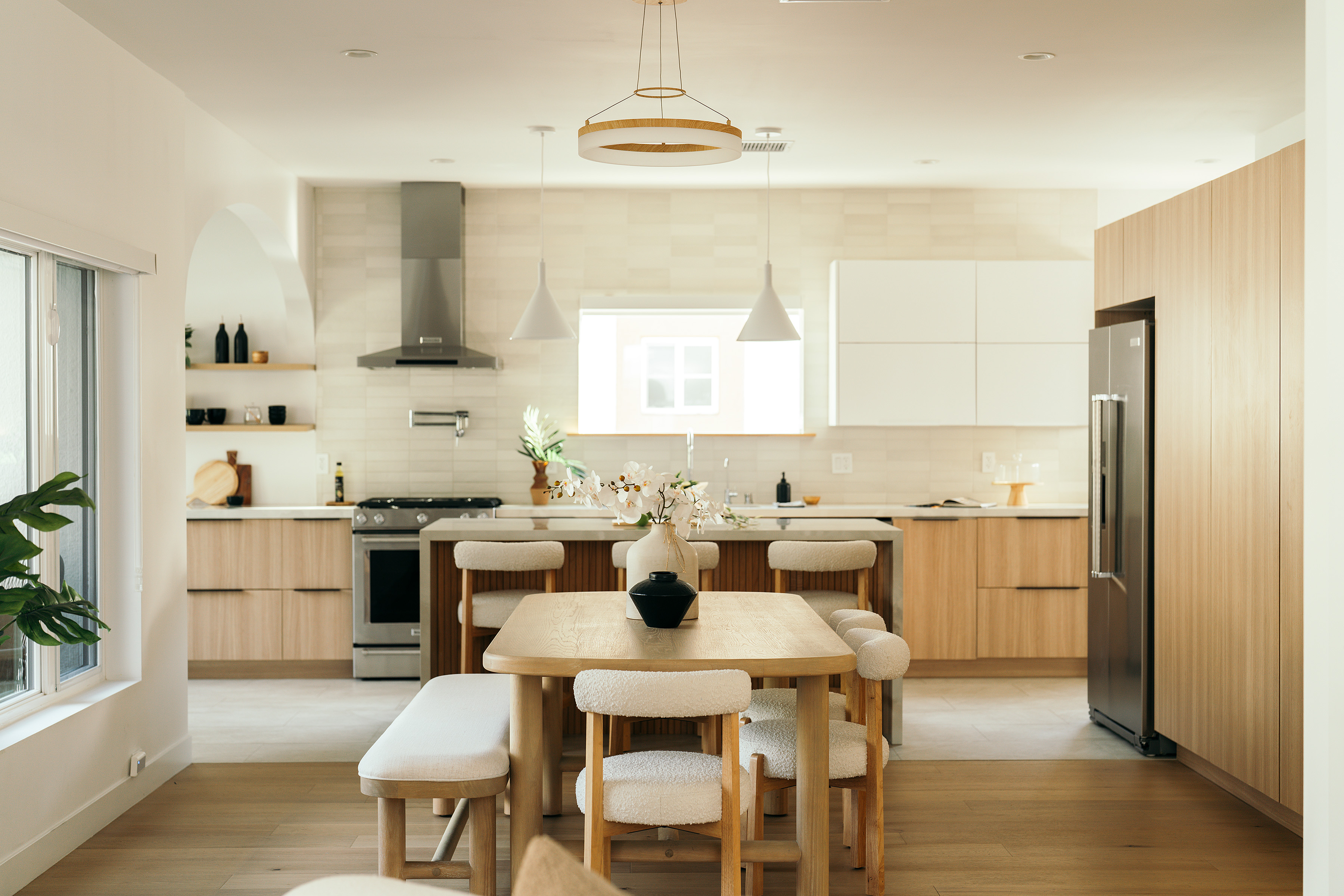 Front view of the light wood kitchen and dining area in West Hollywood